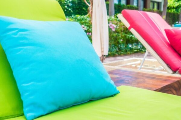 A pink and blue outdoor cushions